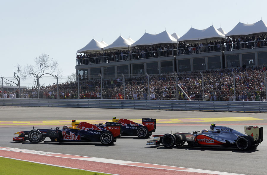 Sebastian Vettel leads Mark Webber and Lewis Hamilton in to the first corner