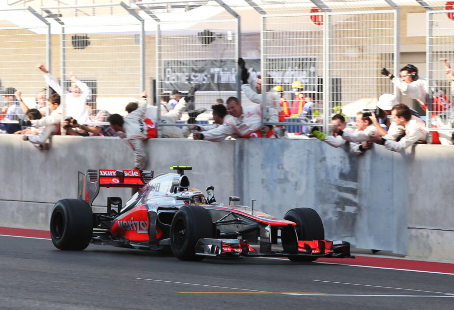 Lewis Hamilton and the McLaren team celebrate the win
