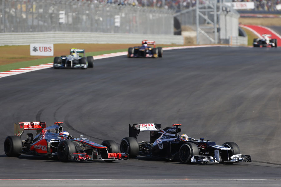 Jenson Button attacks Pastor Maldonado in to turn 12