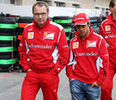 Stefano Domenicali and Felipe Massa walk through the paddock