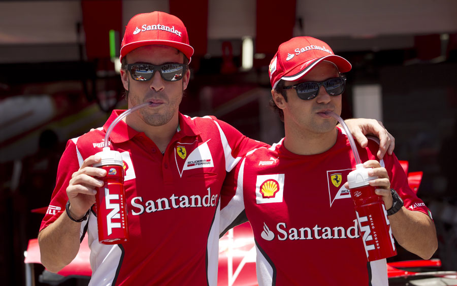 Fernando Alonso and Felipe Massa pose for sponsor photos