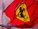 A fan waves a Ferrari flag 