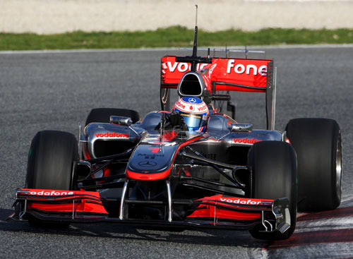 Jenson Button lifts a wheel in his McLaren