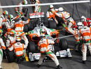 Force India mechanics practice a pit stop