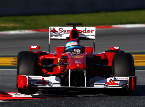 Fernando Alonso blasts through the final chicane