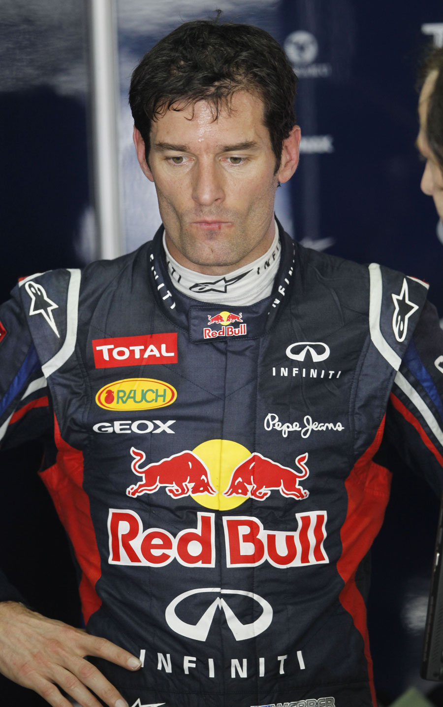 Mark Webber deep in thought in the Red Bull garage