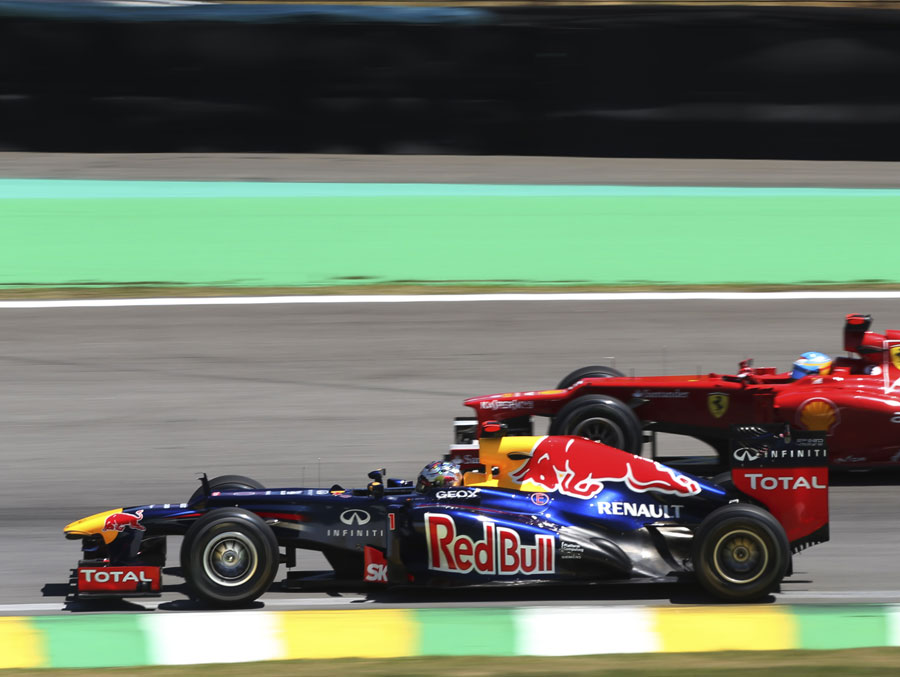 Sebastian Vettel passes Fernando Alonso on track