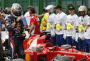 Sebastian Vettel walks past a Ferrari after qualifying fourth