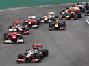 Lewis Hamilton leads the pack through turn one as Sebastian Vettel loses ground at the start