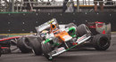 Nico Hulkenberg goes airbourne as he collides with Lewis Hamilton
