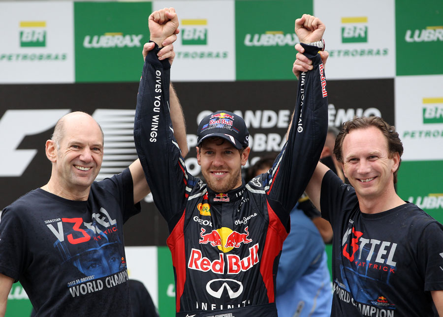 Sebastian Vettel celebrates his third world title with Adrian Newey and Christian Horner