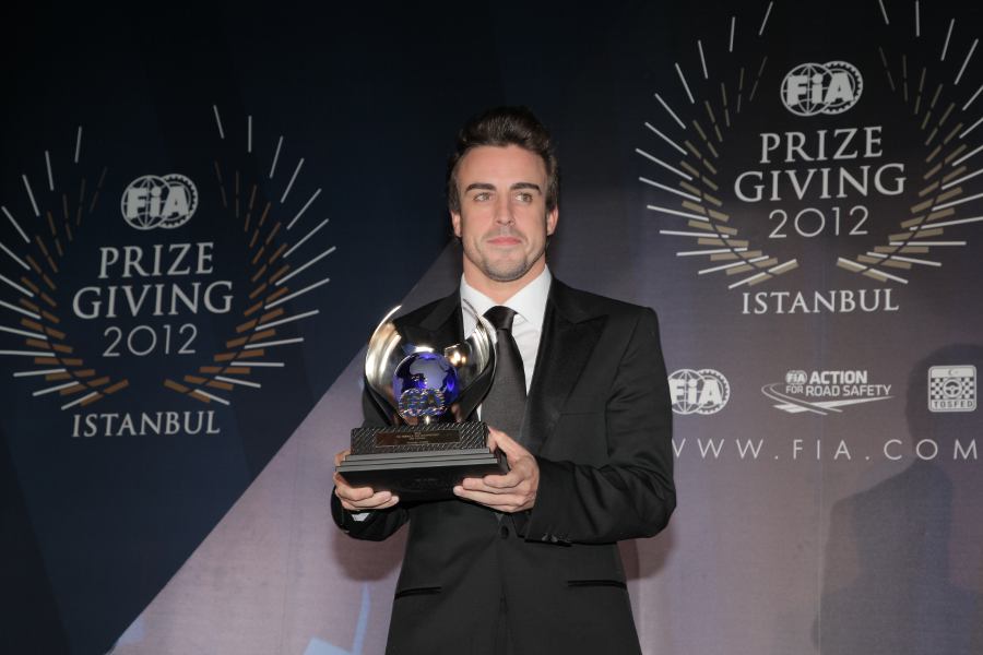 Fernando Alonso receives his award for second place in the drivers' championship at the FIA prize-giving gala
