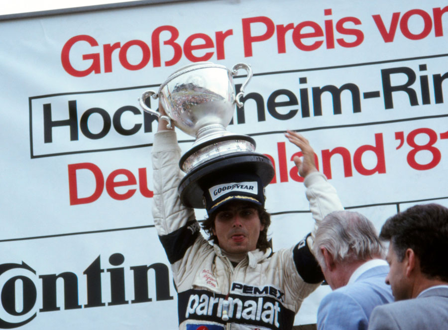 Nelson Piquet celebrates his victory on the podium
