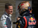 Michael Schumacher talks to Sebastian Vettel in parc ferme