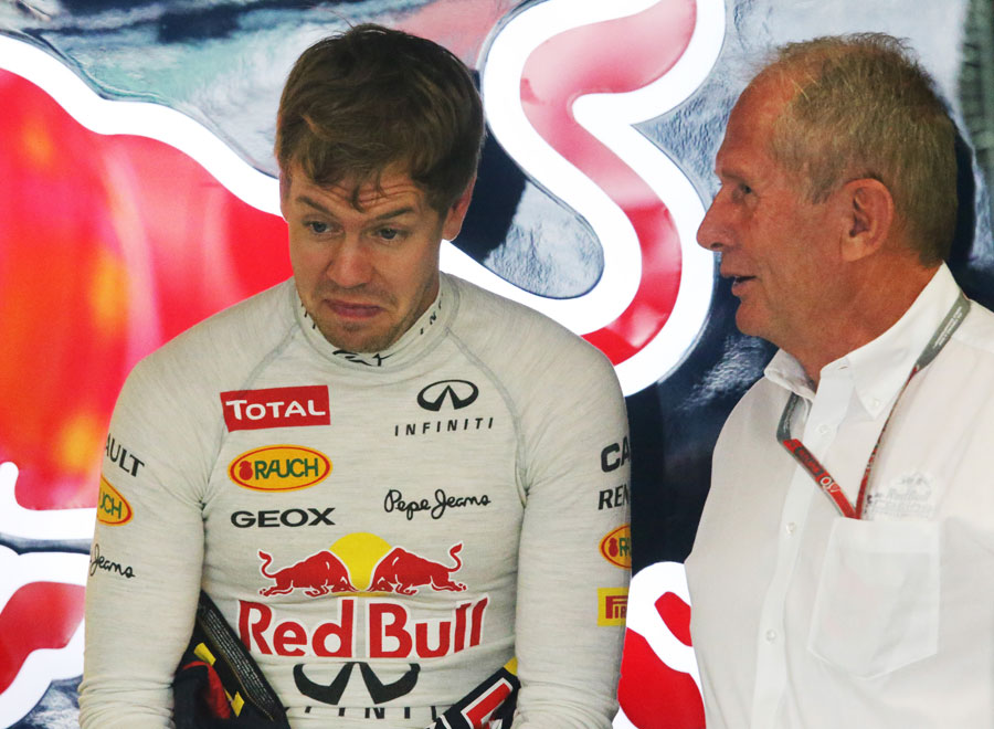 Sebastian Vettel chats with Helmut Marko in the Red Bull garage