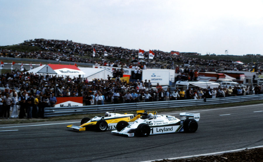 Alan Jones attempts a move around the outside of Alain Prost at Tarzan