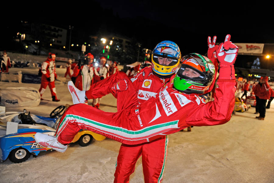 Fernando Alonso holds up Giancarlo Fisichella after the Ferrari ice race