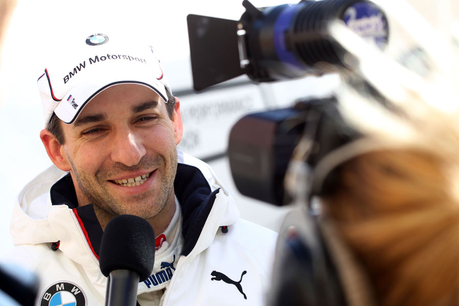 Timo Glock conducts an interview during his first test with BMW in DTM
