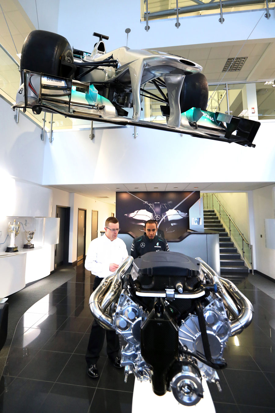 Lewis Hamilton takes a closer look at a Mercedes engine