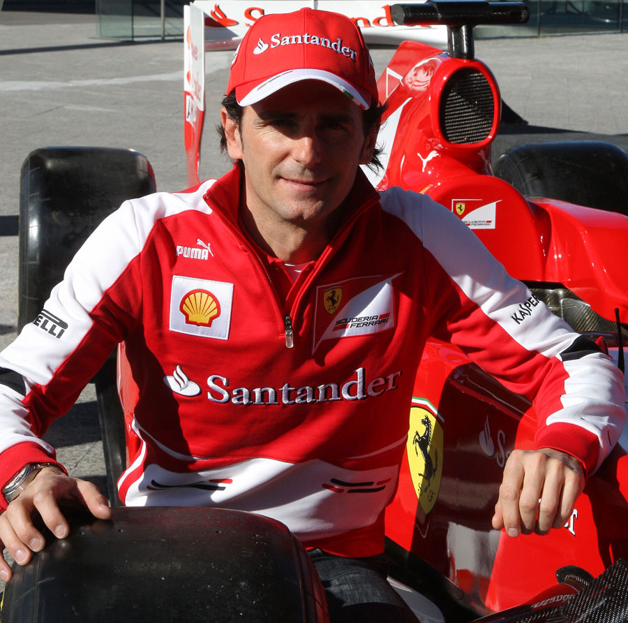 Pedro de la Rosa poses with a Ferrari during a Santander event