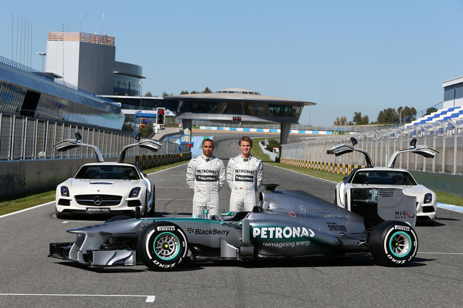 Nico Rosberg and Lewis Hamilton pose with the new Mercedes W04