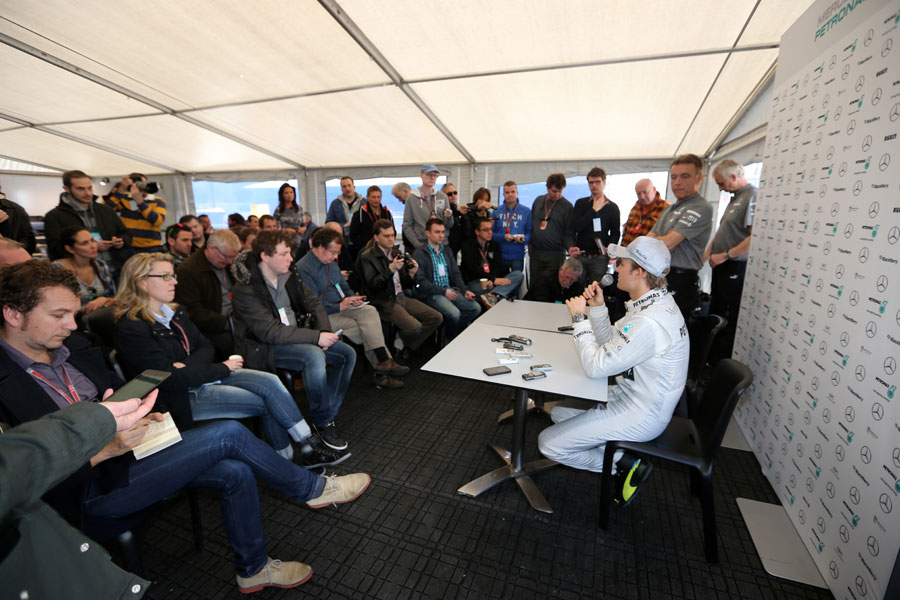 Nico Rosberg addresses the media after his first run in the Mercedes W04