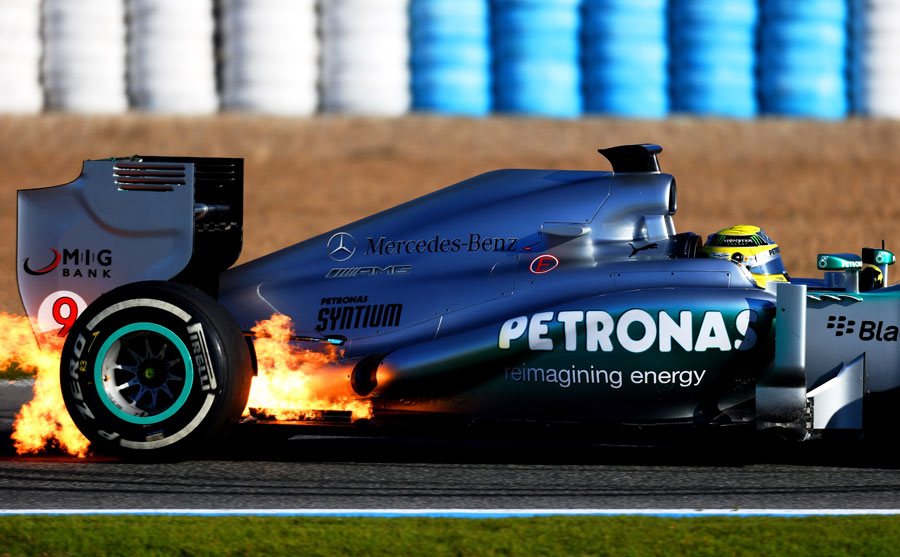 Flames burst out of the rear of Nico Rosberg's W04