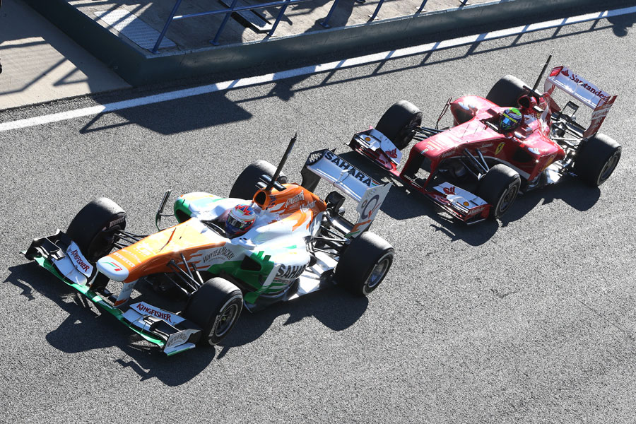 Felipe Massa follows Paul di Resta out on track