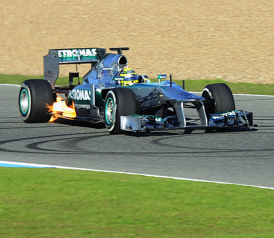 Flames burst out of the rear of Nico Rosberg's W04