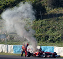 Pedro de la Rosa scrambles clear of his smoking Ferrari