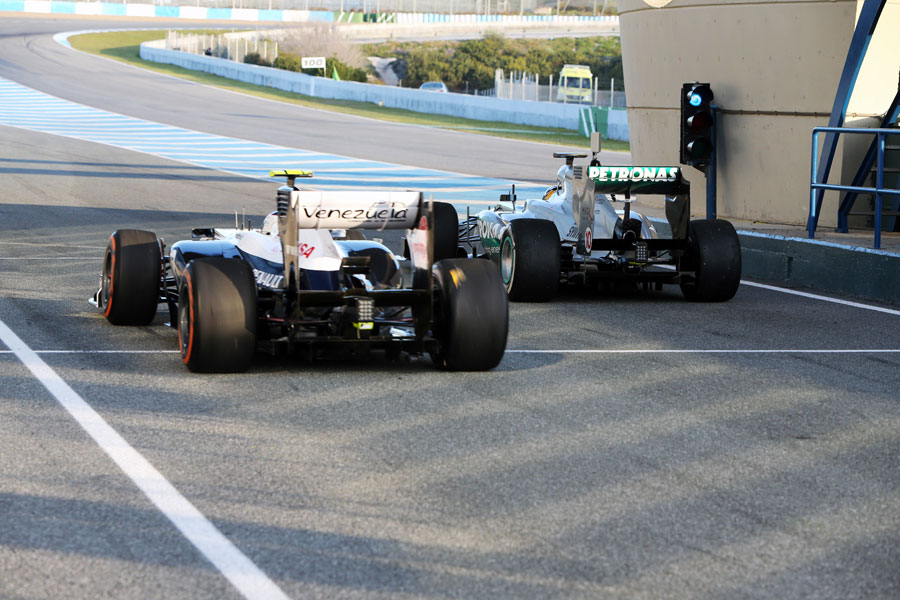Valtteri Bottas passes Lewis Hamilton in the pit lane