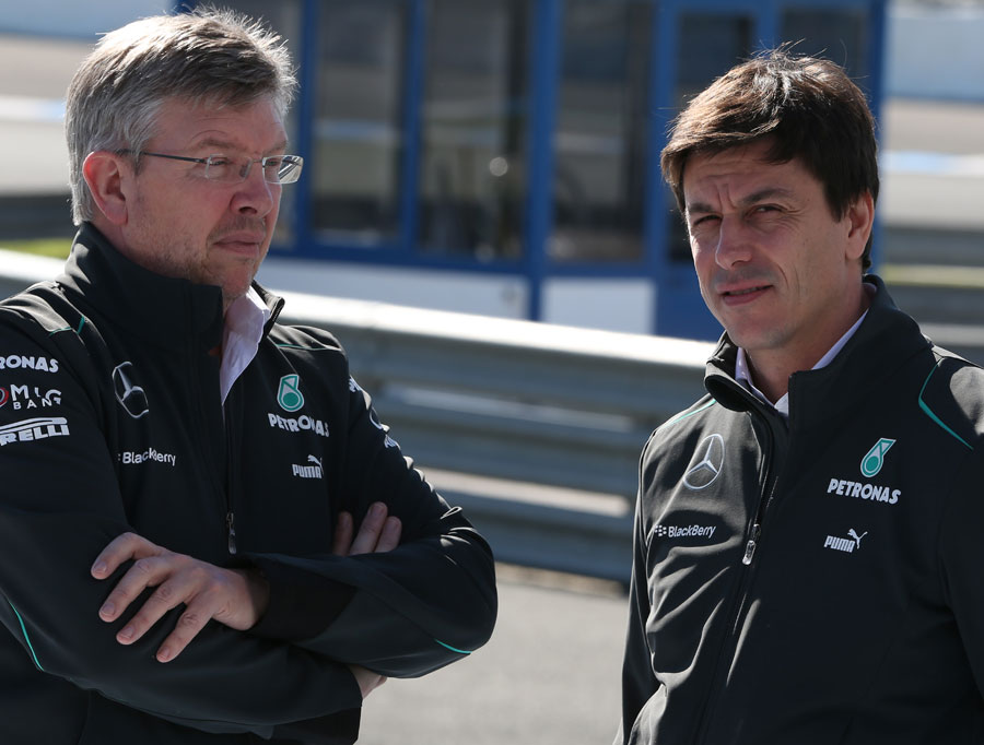Mercedes bosses Ross Brawn and Toto Wolff talk in the paddock