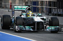Nico Rosberg heads down the pit lane with aero-measuring equipment on his Mercedes