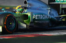 Lewis Hamilton on track in a Mercedes doused in aero paint