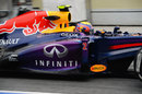 Mark Webber exits the pitlane in the Red Bull