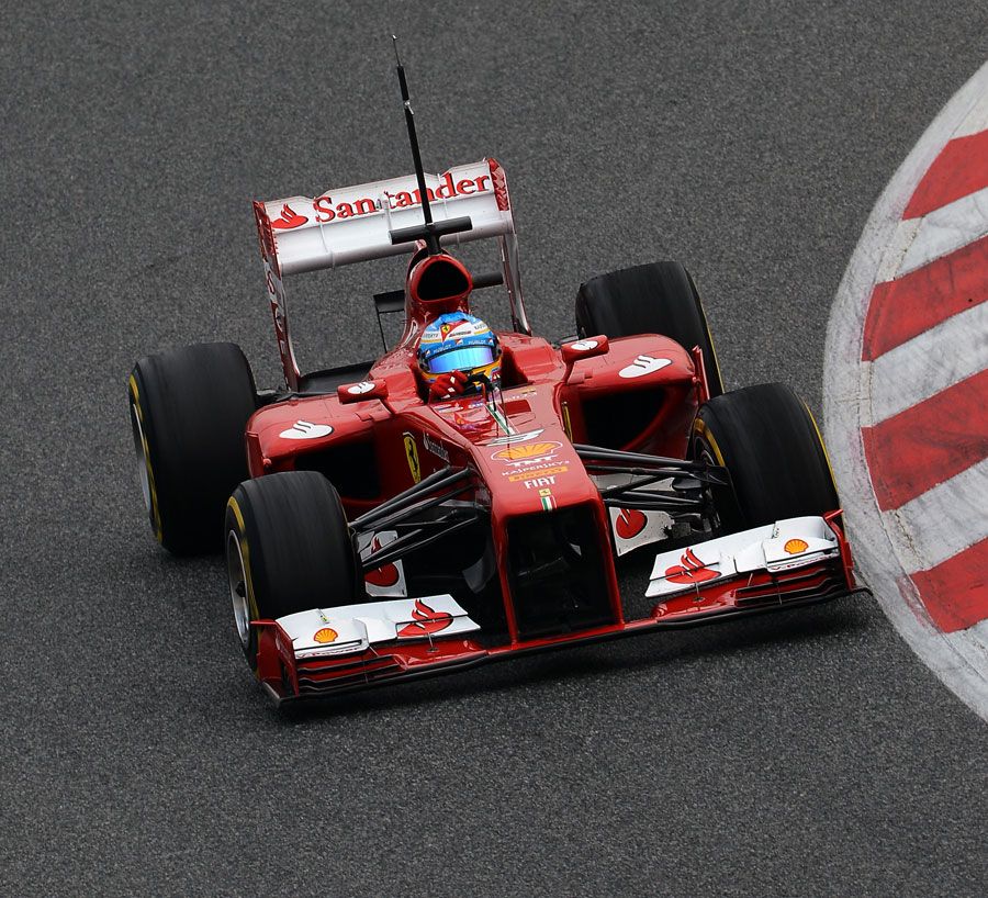 Fernando Alonso tackles the Catalunya circuit in the Ferrari