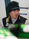 Charles Pic deep in conversation in the Caterham garage