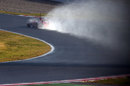 Felipe Massa leaves a plume of spray