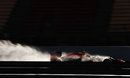 Mark Webber blasts through the spray in the RB9