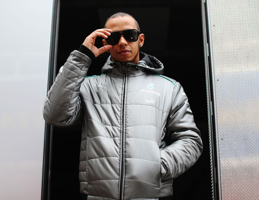 Lewis Hamilton poses for a photo outside the Mercedes motorhome