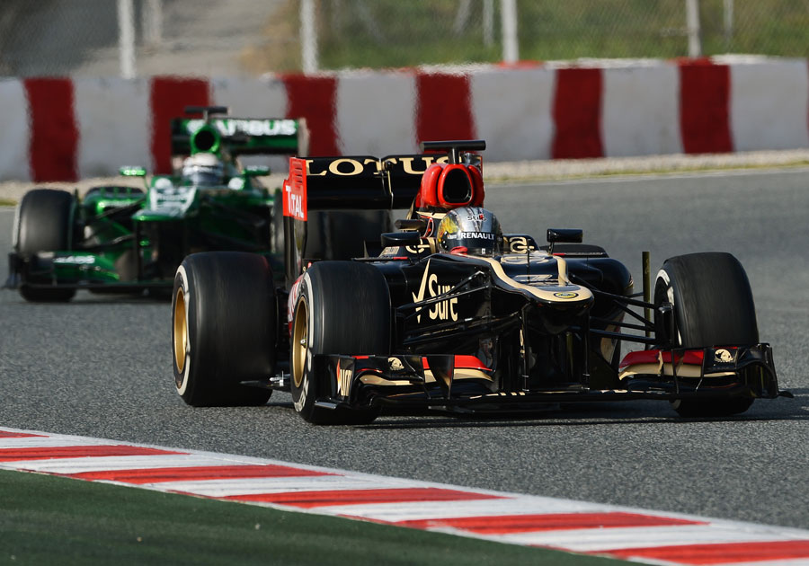 Davide Valsecchi on track in the Lotus ahead of Giedo van der Garde's Caterham