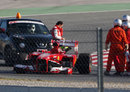 Felipe Massa's Ferrari minus a wheel after an upright failure