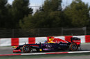 Sebastian Vettel on track in the Red Bull, complete with aero measuring devices at the rear