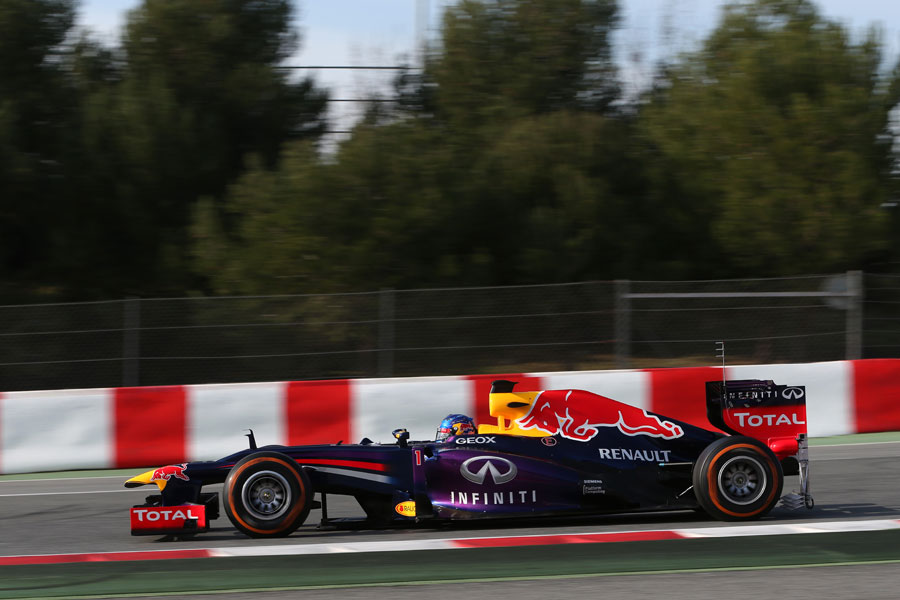 Sebastian Vettel on track in the Red Bull, complete with aero measuring devices at the rear