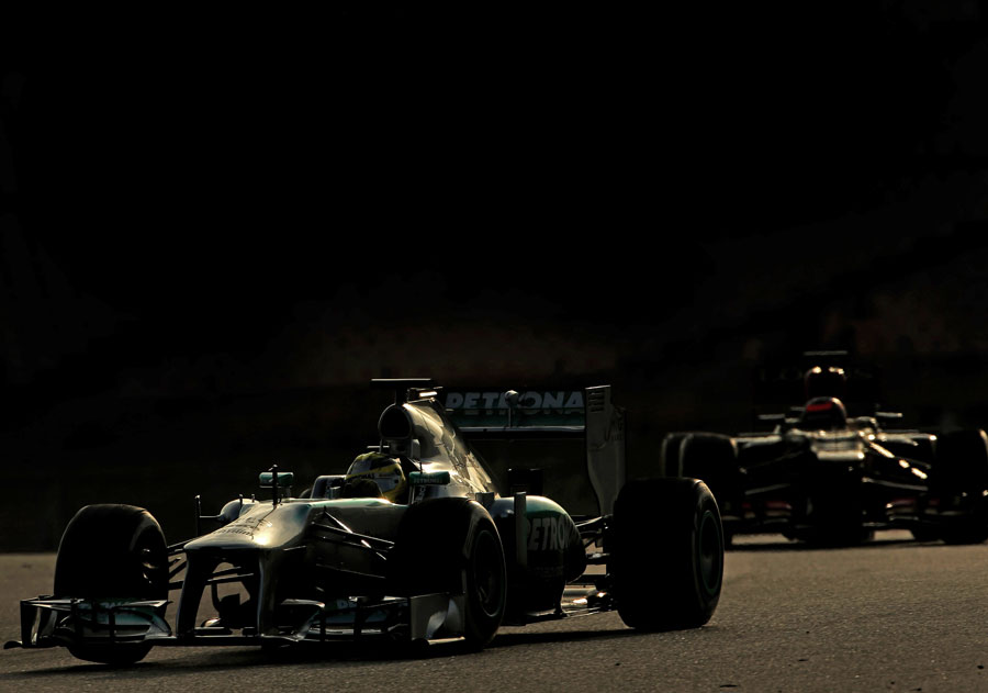 Nico Rosberg leads Kimi Raikkonen on track
