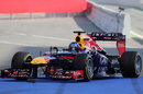 Sebastian Vettel returns to the Red Bull pits