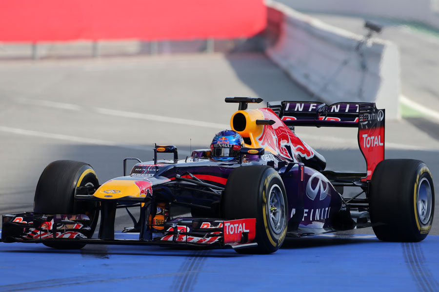 Sebastian Vettel returns to the Red Bull pits
