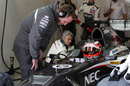 Nico Hulkenberg waits in the Sauber garage