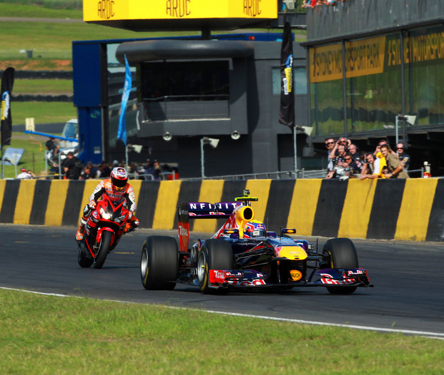 Mark Webber and Casey Stoner on track at Sydney Motorsport Park