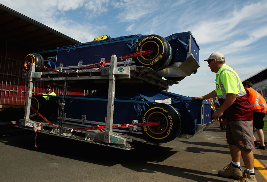 Tor Rosso cars are unloaded into the pit lane at Albert Park